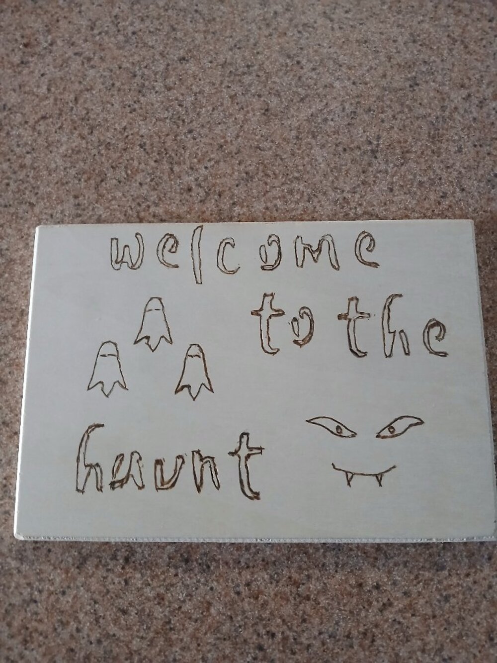 Welcome to the haunt! Wood burned plaque/sign